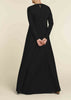 Black colour. Cut in 100% cotton jersey with a fitted bodice & voluminous drop. Styling details include a round neckline with subtle pleats. Features button fastenings on the back & sleeve cuffs. 