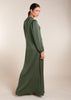 Crafted from smooth, wrinkle-resistant fabric, the Crinkled Abaya Sage boasts a graceful A-line silhouette that complements all body types. Its rich Bottle Green color exudes sophistication, making it a perfect addition to your wardrobe.