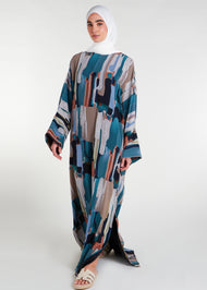 This print Kaftan boasts a full lining, side slits for ease of movement, and a free-flowing design that is ideal for the summer season. For a snugger fit, choose a size down as the Kaftan is designed to be loose-fitting. Paint brush splashes in multicolour, vertical.
