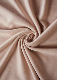 Effortless to style and incredibly comfortable to wear, with a subtle sheen. The medium-thick weight is soft, breathable, fully opaque and durable. Jersey works well in all climates, can be worn without an under scarf or pins, and makes a great option for working out. Light nude pink.