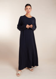 This elegant Two Piece Open Abaya set includes a Full Sleeve matching inner dress. Perfect for everyday wear, it can also be dressed up with accessories for an evening look. The open abaya can be worn as a maxi on its own or paired with the inner dress for a stylish ensemble. In navy.